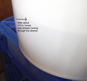 Look at the honey line on the bucket, just after 1/2 hour of straining. 